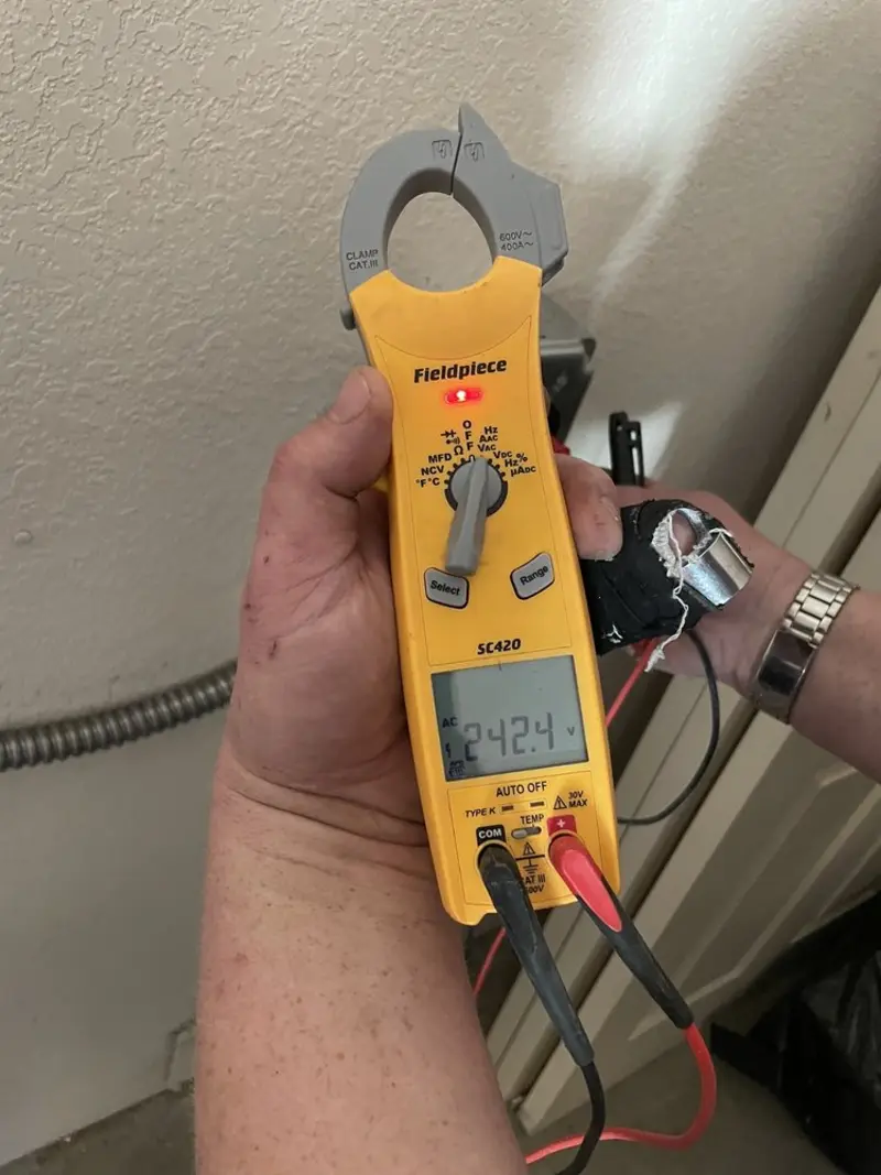 Voltage testing with clamp meter during Circuit Breaker Repair in Hobart